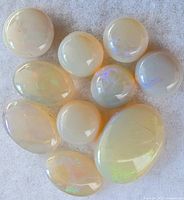 Cabochon opal with milky body and play-of-color
