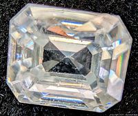 Top view of rectangular step-cut moissanite stone