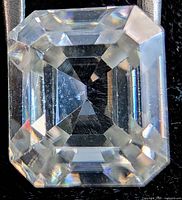 Front view of the emerald-cut moissanite showing clarity and facet pattern