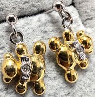 front view of both drop earrings showing gold-tone teddy bear design and diamond accents
