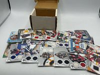 All cards spread in front of box showing multiple patch cards