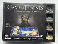 Front of retail box displaying title, piece count, age rating and completed puzzle image