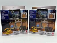 Front view of two sealed playset boxes