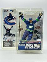 Front view of sealed Markus Naslund action figure in packaging