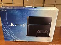 Front of retail box showing Sony PS4 500GB console