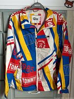 Front view of multicolor Tommy Hilfiger Denim jacket on hanger