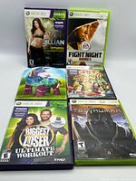 Six Xbox 360 game cases front view