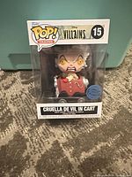 Front view of boxed Funko Pop Cruella de Vil in Cart