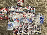Overall lot showing both boxes and loose cards spread out