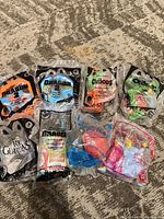 All eight sealed DreamWorks Happy Meal toys laid out on floor
