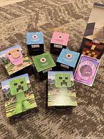 Top view of eight sealed McDonald’s Minecraft Happy Meal toys