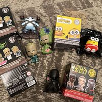 Group shot of all five Funko Mystery Minis figures with boxes and bag