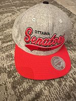 Front view showing Ottawa Senators Hockey embroidery and red brim