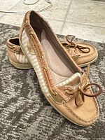 Top and side view of both shoes showing overall style and materials