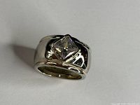 Front view of sterling silver ring showing square cubic zirconia