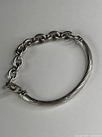 Full view of sterling bracelet showing ribbed bar and round link chain