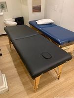 Massage table set up, legs extended, face plug in place