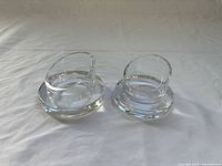 Two clear crystal bowls side by side