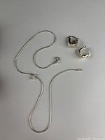 Snake chain necklace, cubic zirconia pendant, pair of chunky hinged hoop earrings