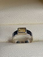 Front view of sterling silver ring with rectangular citrine
