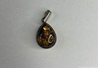 Front view of sterling silver teardrop amber pendant