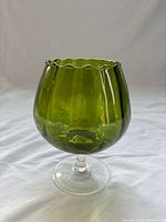 Side view of green Empoli pedestal vase