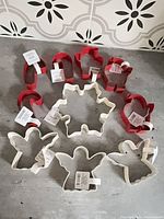 All ten cookie cutters arranged on surface