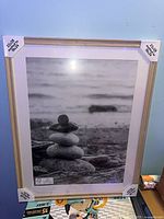 Front view of full frame showing wood-tone border and white mat