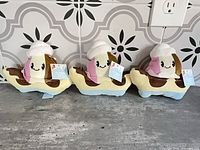 Three banana split ice cream plush toys with tags