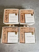 Four boxed Threshold stamp sets front view