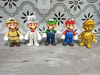 Front view of all five figures lined up