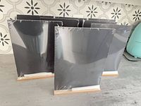 Eight wrapped chalkboards on wood bases with chalk