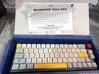 Keyboard in box with manual showing model and layout