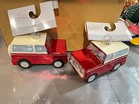 Both glass truck ornaments with tags visible