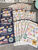 Sticker books displayed showing both School and Good Vibes covers