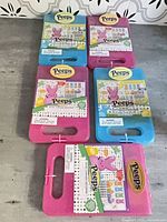 Five Peeps travel clipboard kits, three pink two blue