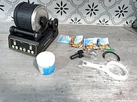 Overall lot showing tumbler, stones, grit, strainers and tools