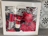 Front of boxed Wondershop ribbon and bow set showing contents