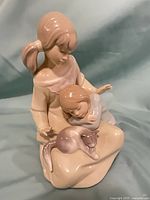 Front view showing full composition of two sisters and cat