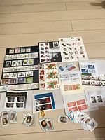 Overview of entire stamp collection laid out on floor