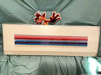 Front view of framed Morris Louis poster showing artwork and printed details