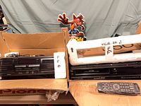 Pioneer cassette deck and Mitsubishi VCR in boxes