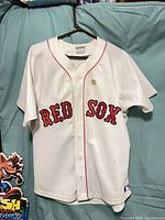 Front view of jersey showing team name, buttons and overall condition