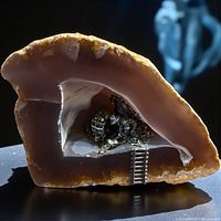 Full view of agate geode sculpture with mining scene visible