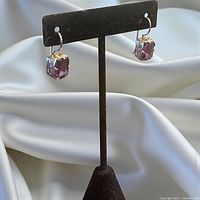 Front view showing sterling hooks and square faceted amethyst stones