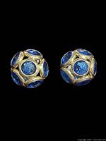 Front view of both domed sapphire earrings