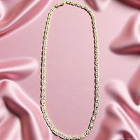 Full view of sterling silver chain necklace laid flat showing overall length and link style