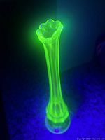Vase glowing bright green under UV light