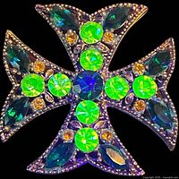 Front view of Maltese cross brooch showing all stones