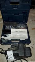 Blue Mastercraft carry case open with mortising attachment contents and Black & Decker belt sander in foreground